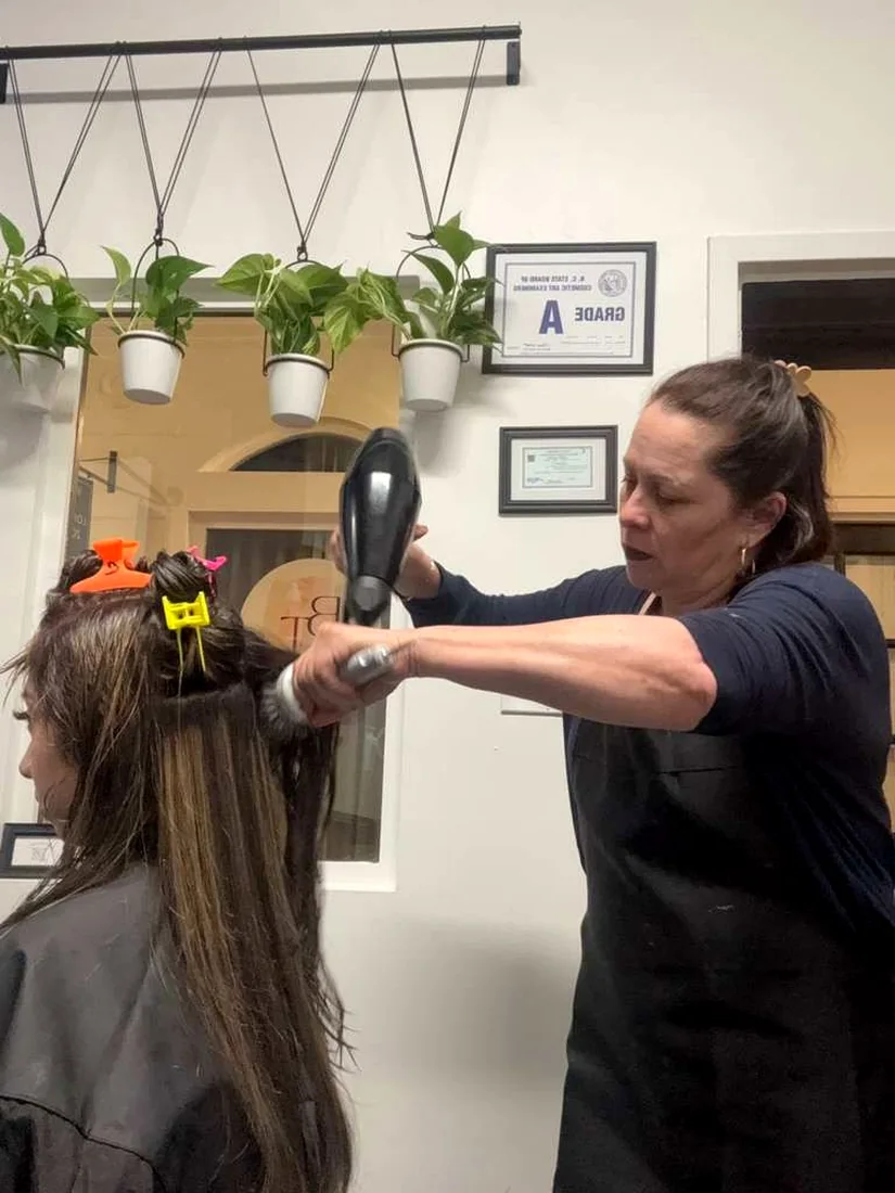 Stylist blow-drying