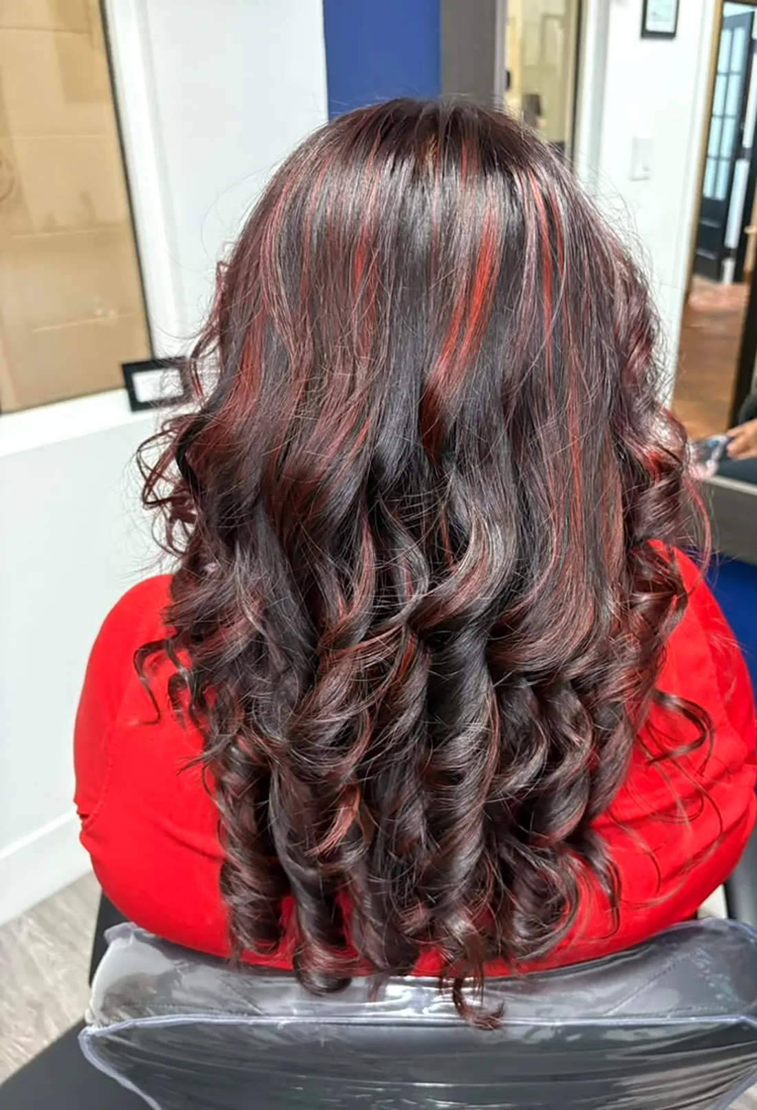 Dark hair with red dimensional streaks